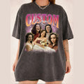 A person wearing a dark gray custom photo collage graphic t-shirt with a vintage 90s rap tee design.
