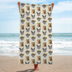 Personalized Microfiber Beach Towel held vertically at the beach, featuring a repeating pattern of cat faces on a cream