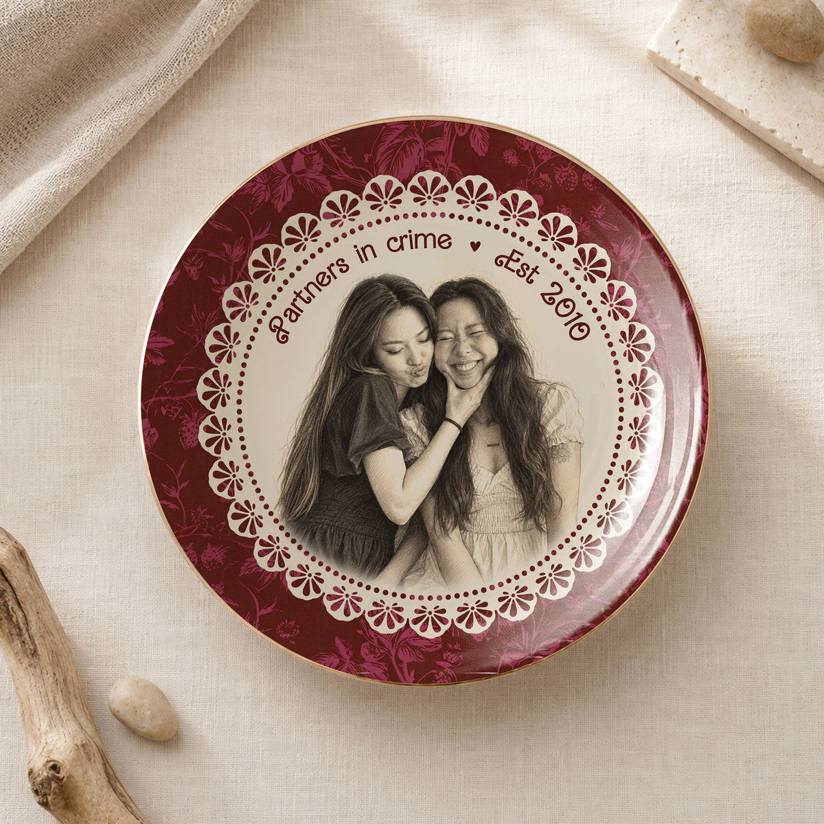 Burgundy round ceramic trinket dish featuring a custom pencil-sketch portrait of two women framed by a vintage lace border.