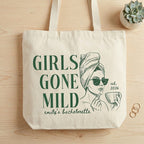 Natural canvas bachelorette party favor tote bag showcasing green Girls Gone Mild text and custom bride design graphic.