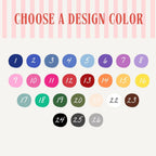 Design color chart with twenty-six numbered colorful circular swatches under heading Choose a Design Color on pink striped