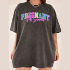 Woman wearing a dark charcoal grey short-sleeve graphic cotton t-shirt featuring Pregnant Girl Summer print.
