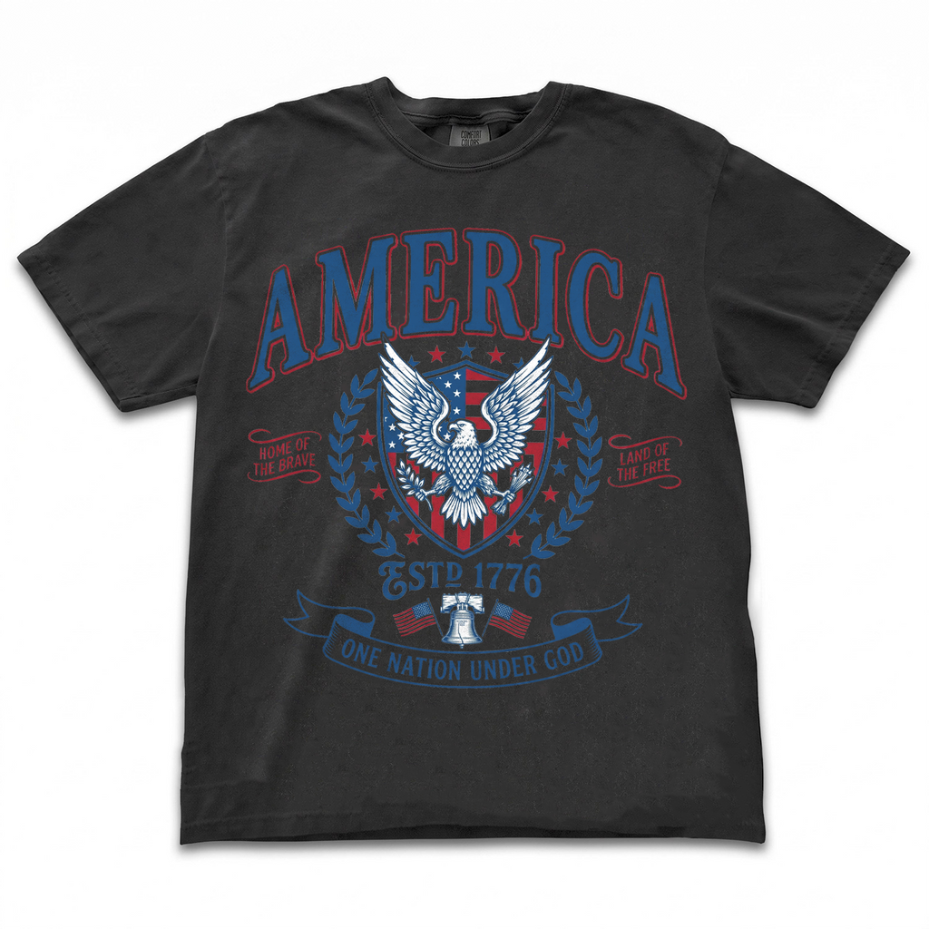 Black garment-dyed t-shirt laid flat with a vintage America patriotic eagle graphic tee design on the front
