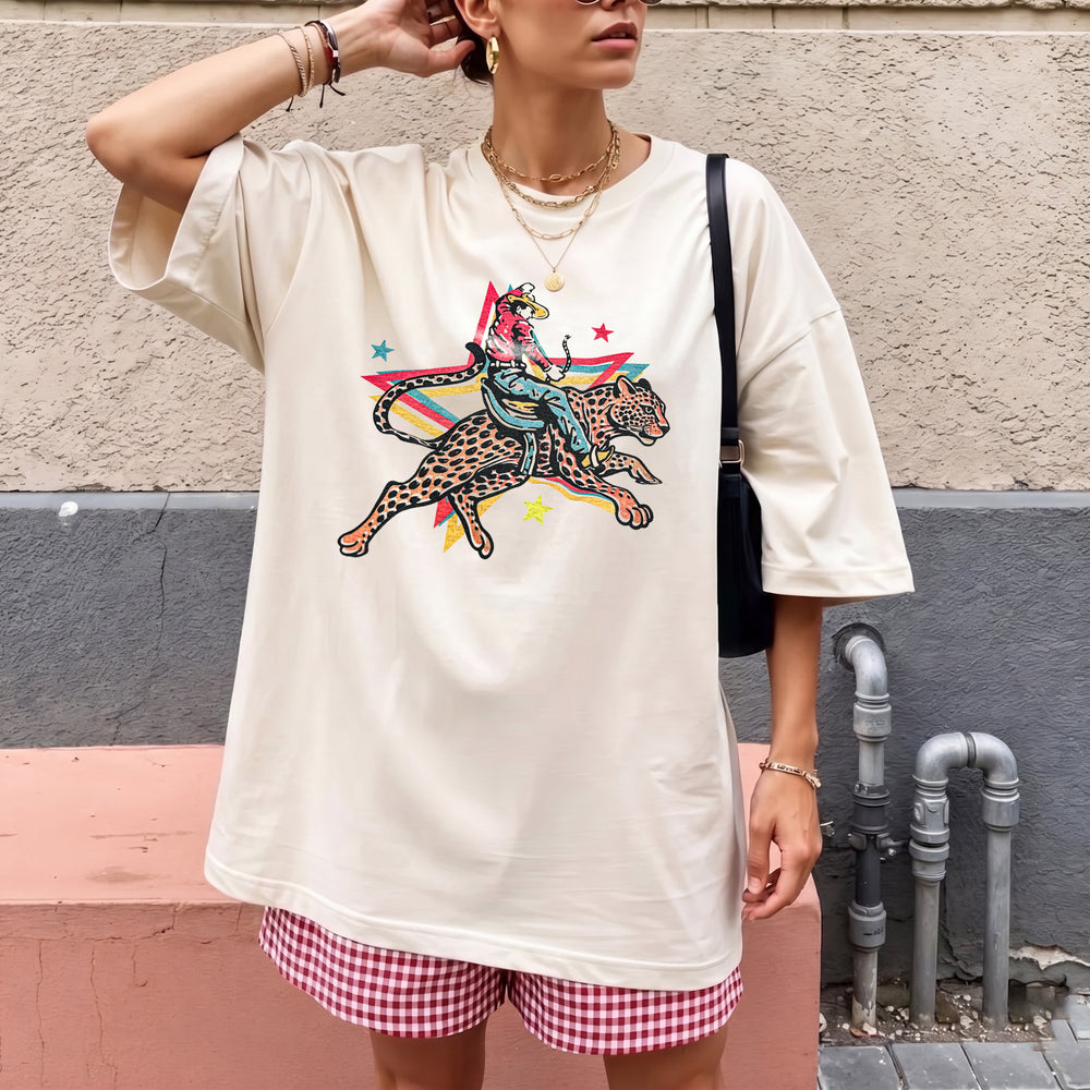 RodyThread Rodeo Leopard Wild Ride Oversized Graphic T-Shirt Women's Retro Western Country Music Festival Chic Cream Cotton Blend Vintage Cowgirl She's A Wild One Graphic Tee Trendy Summer Top Y2K Aesthetic Streetwear Leopard Print Outfit