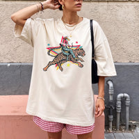 RodyThread Rodeo Leopard Wild Ride Oversized Graphic T-Shirt Women's Retro Western Country Music Festival Chic Cream Cotton Blend Vintage Cowgirl She's A Wild One Graphic Tee Trendy Summer Top Y2K Aesthetic Streetwear Leopard Print Outfit