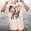 RodyThread Flying Mallard Duck Patriotic 4th Of July Graphic T-Shirt Unisex Men Women Retro Southern Western Aesthetic Cream Cotton Summer Independence Day Waterfowl Hunting Tee Apparel Vintage USA American Flag Country Outdoors Casual Top