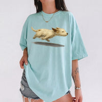 RodyThread Cute Running Dog Graphic Oversized T-Shirt For Women Trendy Vintage Aesthetic Soft Baggy Cotton Cream Tee Casual Streetwear Top Dog Lover Gift Perfect For Dog Walking Outfit Stylish Loose Fit Summer Short Sleeve