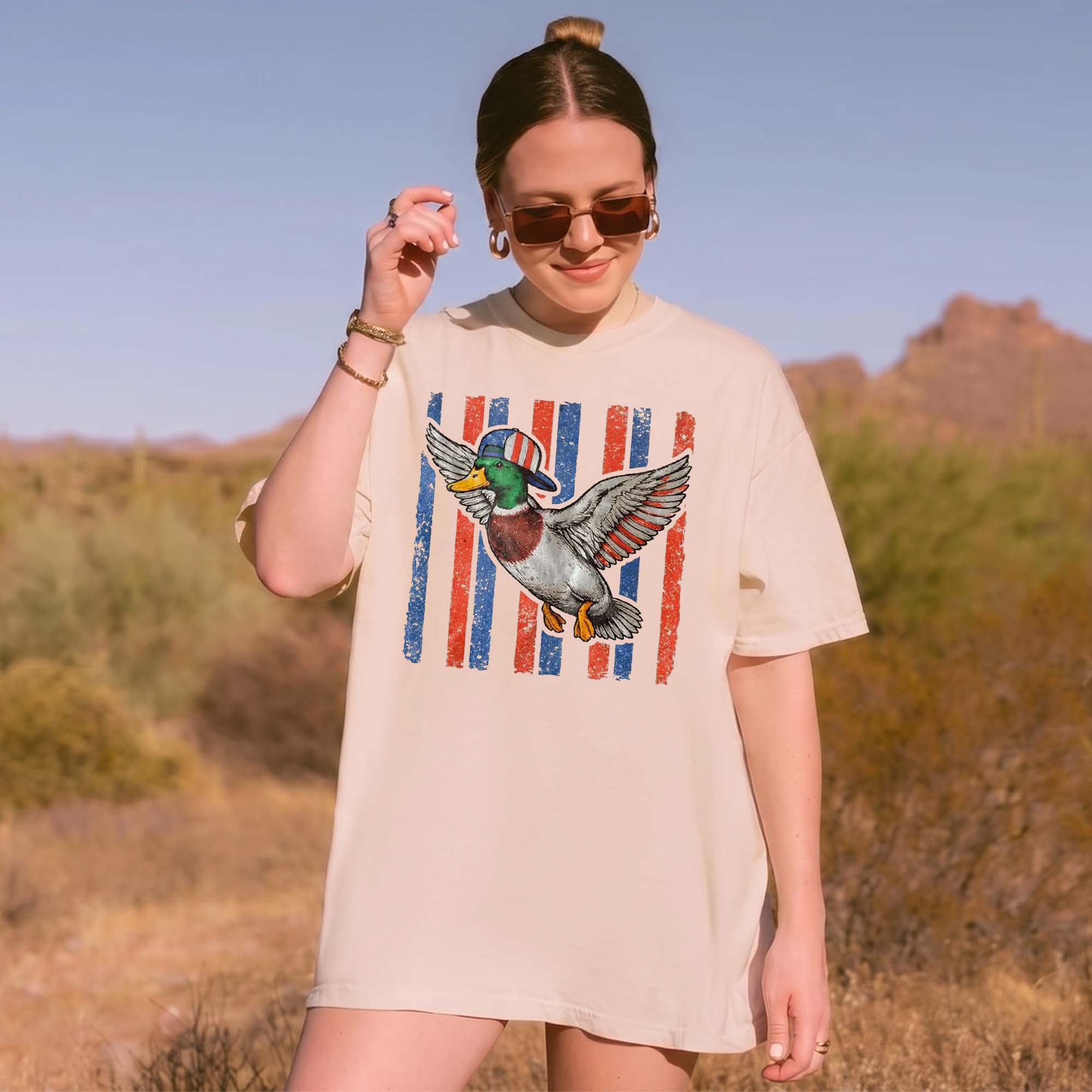 RodyThread Flying Mallard Duck Patriotic 4th Of July Graphic T-Shirt Unisex Men Women Retro Southern Western Aesthetic Cream Cotton Summer Independence Day Waterfowl Hunting Tee Apparel Vintage USA American Flag Country Outdoors Casual Top