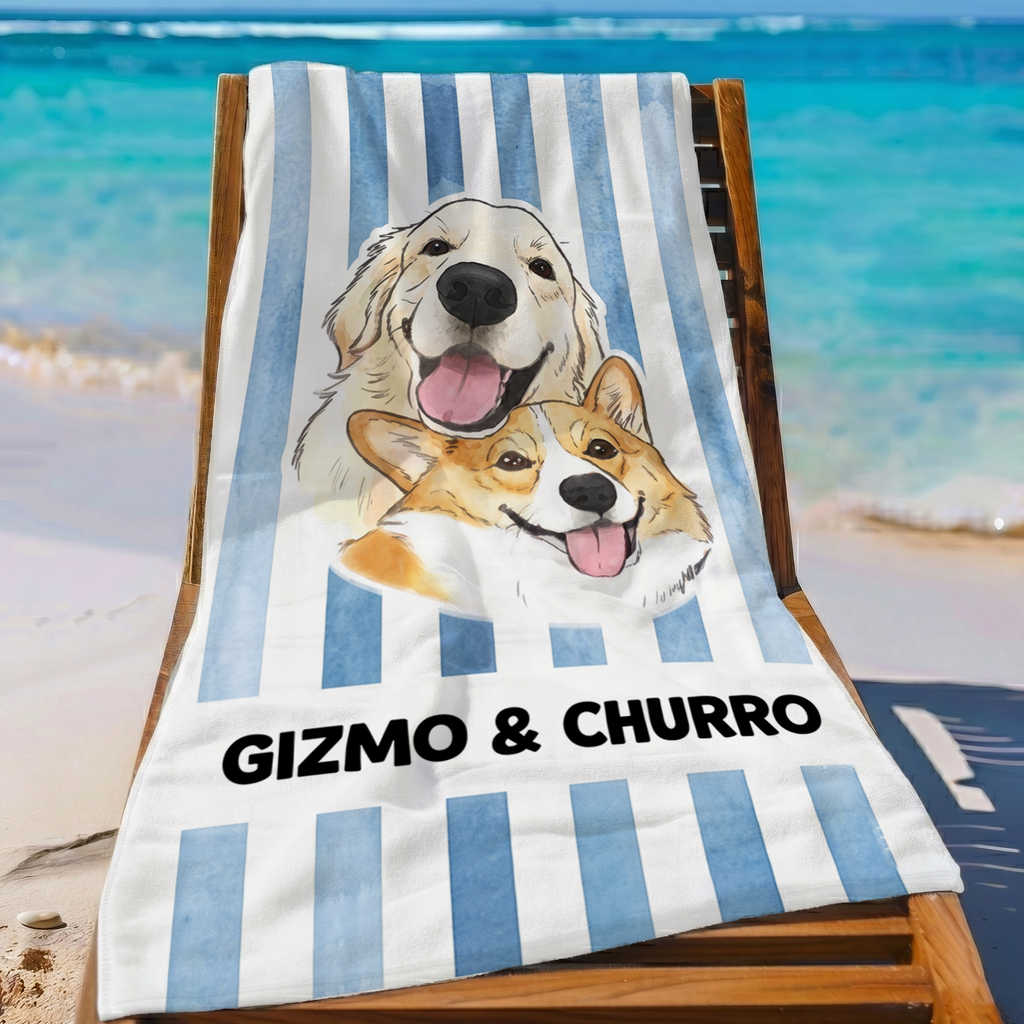 Blue striped personalized dog portrait beach towel laid out on a wooden lounge chair by the ocean.