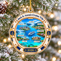 Personalized Alaska cruise map acrylic ornament hanging on a snowy Christmas tree branch with warm bokeh lights.