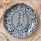 Custom round ceramic ring dish featuring a blue and white toile border, an oval portrait of a border collie, and the name