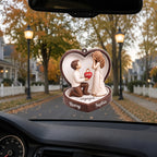 Engaged hanging car ornament featuring a proposal scene in a heart box with names Henry and Sophia, hanging from rearview