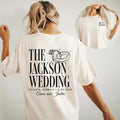 Woman wearing a white personalized wedding t-shirt featuring bold back text, wedding rings graphic, and a small front chest
