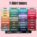 Stacked folded t-shirts in various colors with labels showing available color options.