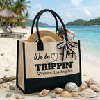 A funny vacation tote customized for Venice Los Angeles with seashell decorations on a tropical beach.