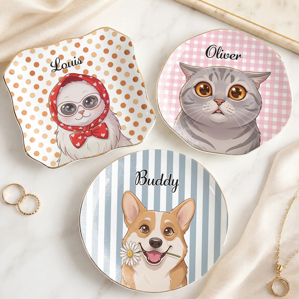 Three custom pet keepsake trinket dishes arranged on a tabletop with rings and jewelry nearby.