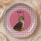 Round ceramic trinket dish featuring a portrait of a tortoiseshell cat named Willow inside a pink gingham border with a gold