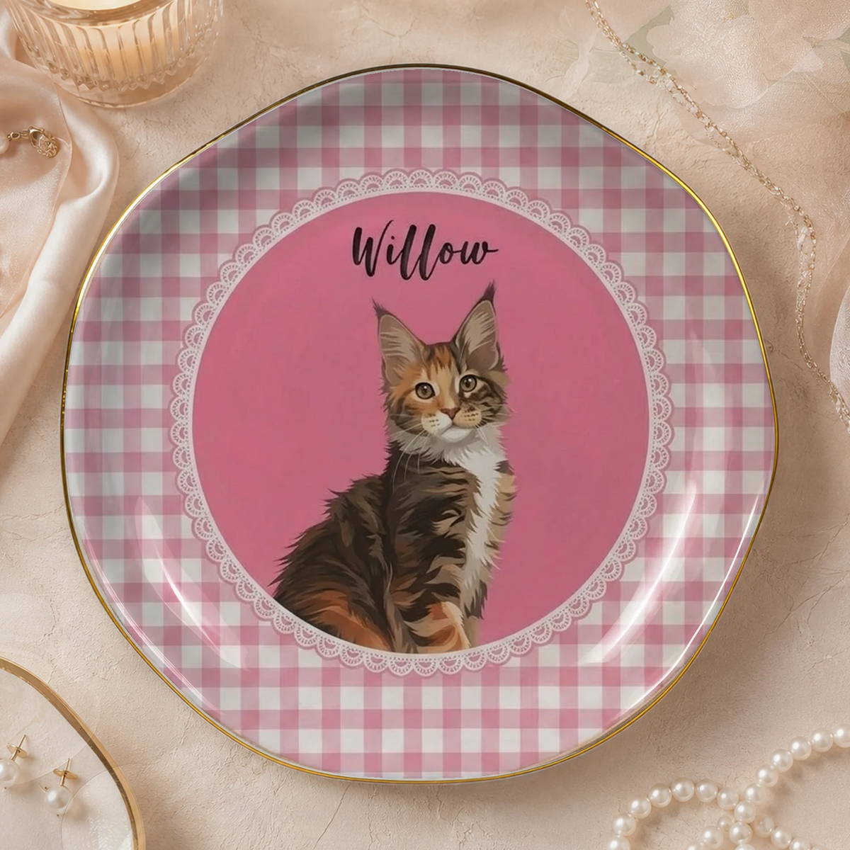 Round ceramic trinket dish featuring a portrait of a tortoiseshell cat named Willow inside a pink gingham border with a gold