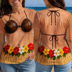 Two people wearing fake coconut bikini graphic tees with grass skirts and flower leis, standing near the ocean.