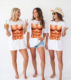 Three smiling women wearing oversized white six pack abs graphic t-shirts and denim shorts in a group bachelorette party