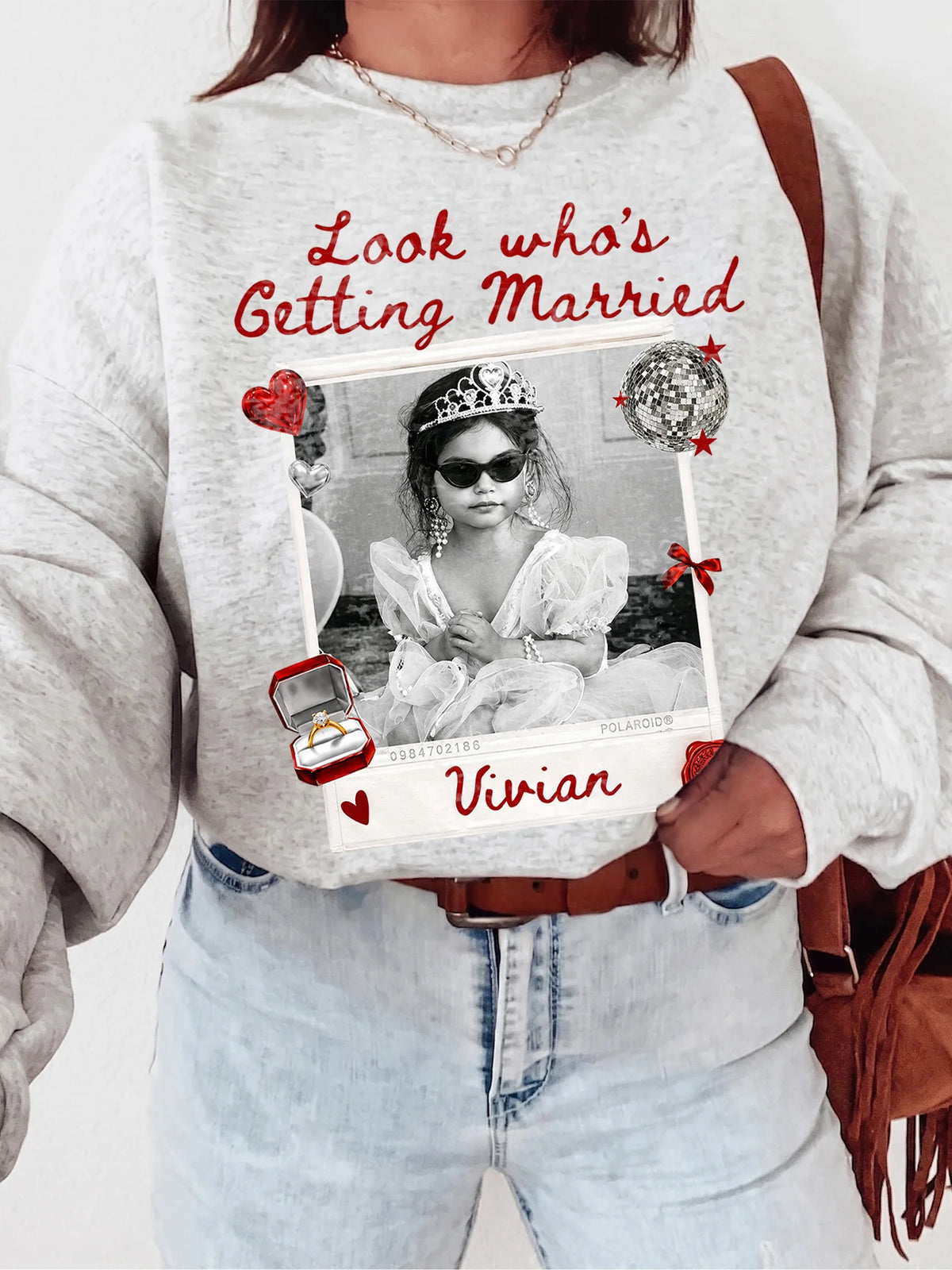 Ash gray crewneck sweatshirt with a custom polaroid print, red accents, and a girl in sunglasses.