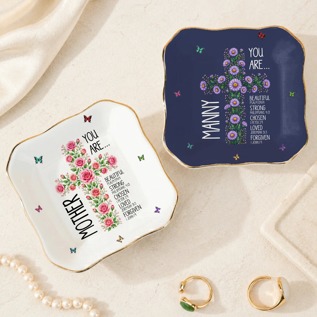 Two square ceramic trinket dishes with gold rims, one white with pink roses and the other navy with purple daisies and custom